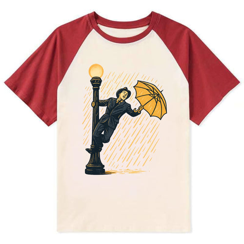 joyful dancing on lamppost in heavy rain with big smile - Contrast Raglan T-shirt