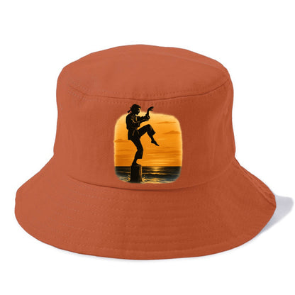 karate crane kick pose on wooden post at beach sunset - Bucket Hat - Red