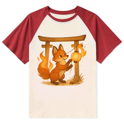 Foxfire kitsune stringing lanterns along a torii gate with tails of - Contrast Raglan T-shirt - Red