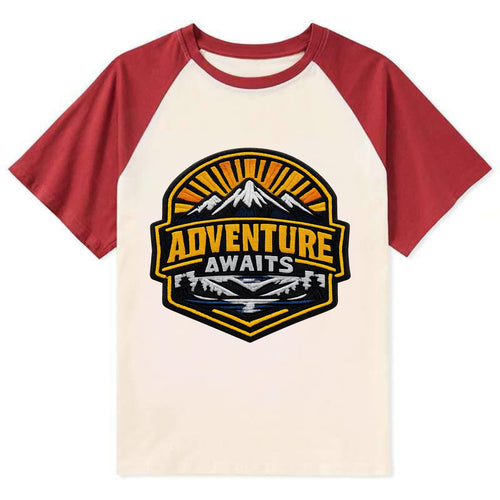 ADVENTURE AWAITS - mountain sunrise with text in gold and blue , - Contrast Raglan T-shirt