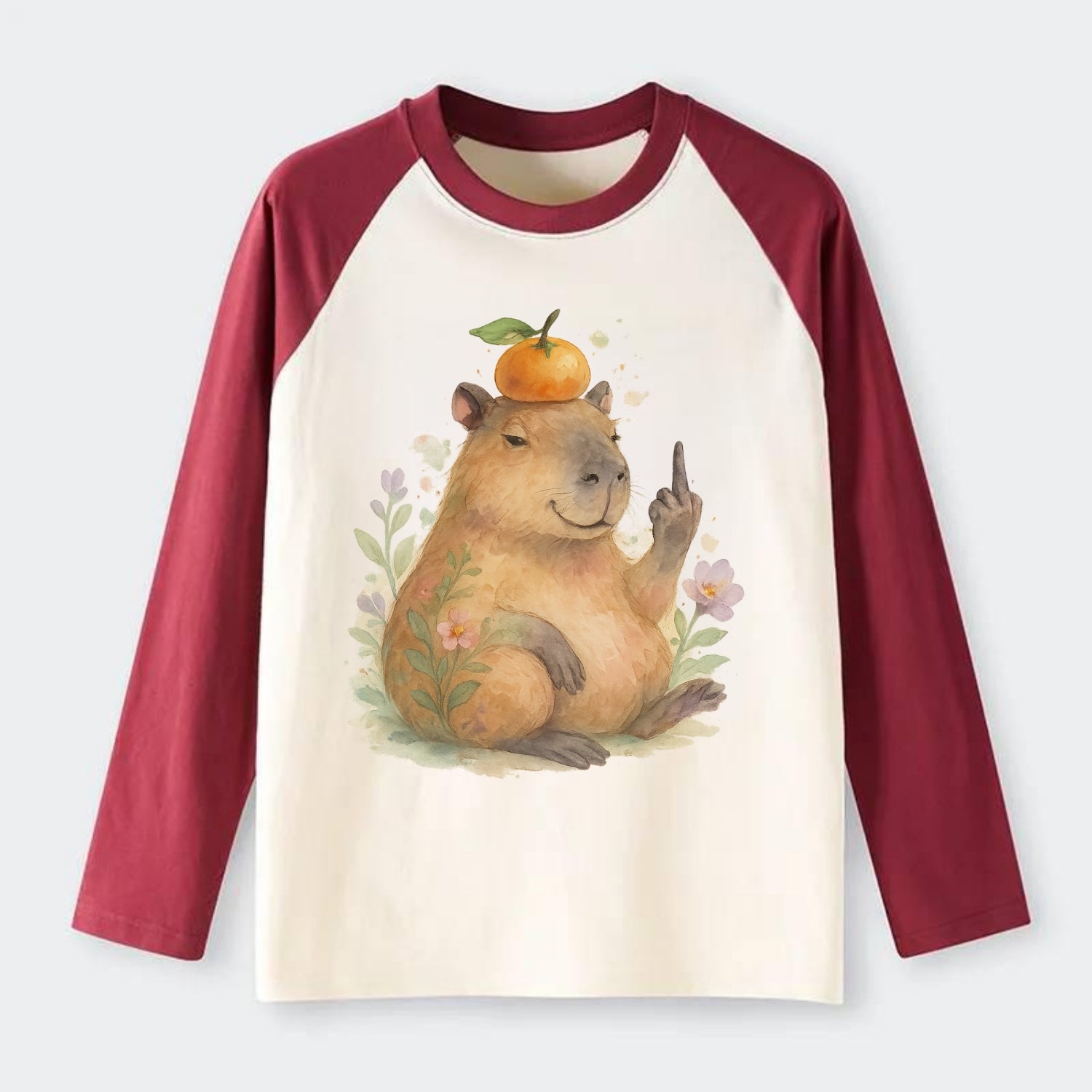 chonky capybara relaxing with orange on head, one webbed middle finger - Raglan Long Sleeve T-Shirt - Red