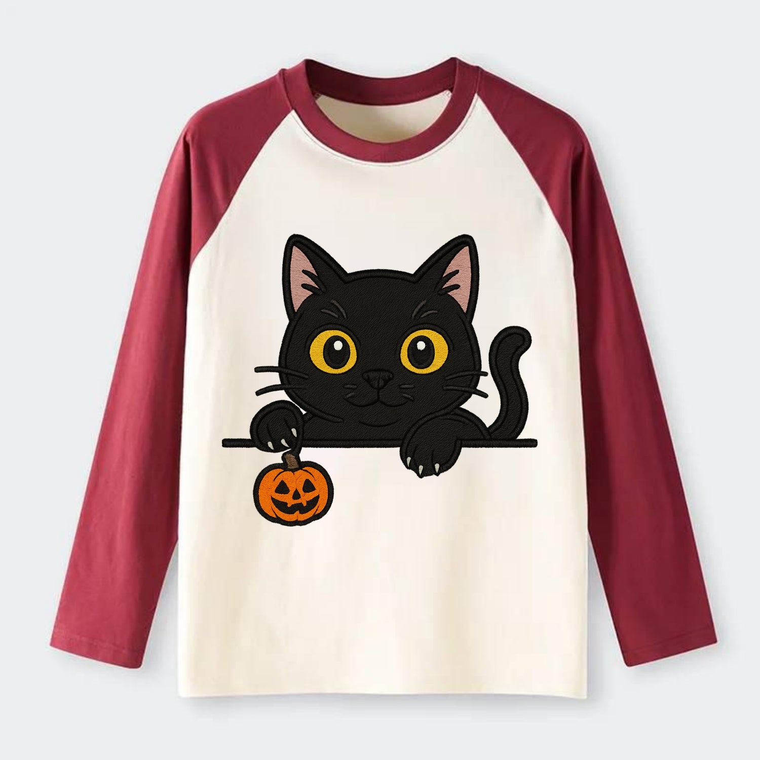 Midnight the black cat poking tongue out playfully while peeking. - Raglan Long Sleeve T-Shirt - Red