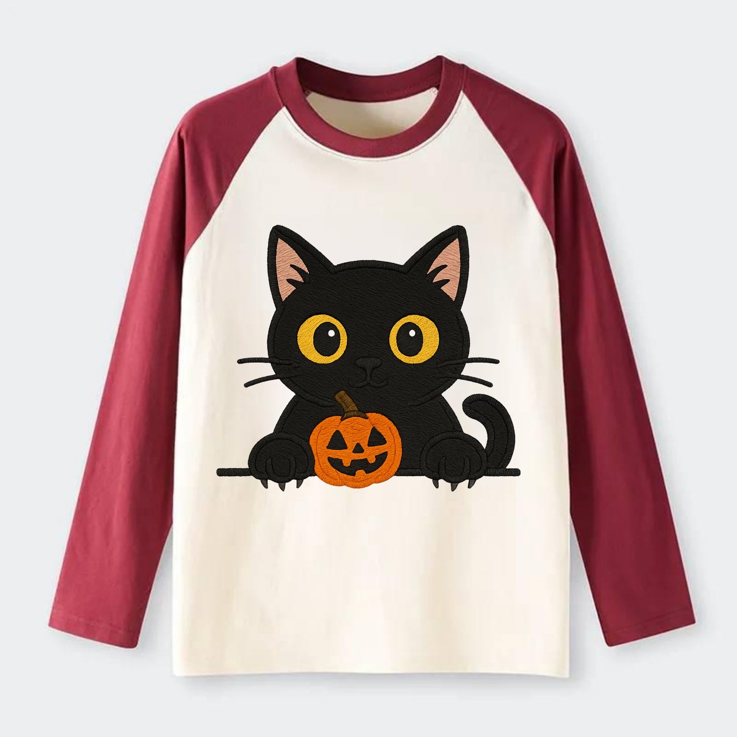 Midnight the black cat wearing round spectacles while studying the - Raglan Long Sleeve T-Shirt - Red