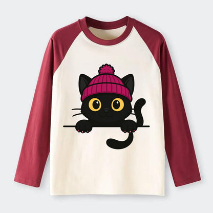 Midnight the black cat holding a tiny book labeled secrets against the - Raglan Long Sleeve T-Shirt - Red