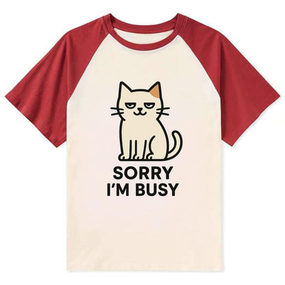 Cat sitting alone looking content - "SORRY I'M BUSY" - not sorry at all - Contrast Raglan T-shirt - Red