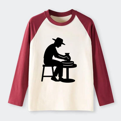 Potter shaping clay on wheel - Raglan Long Sleeve T-Shirt - Red