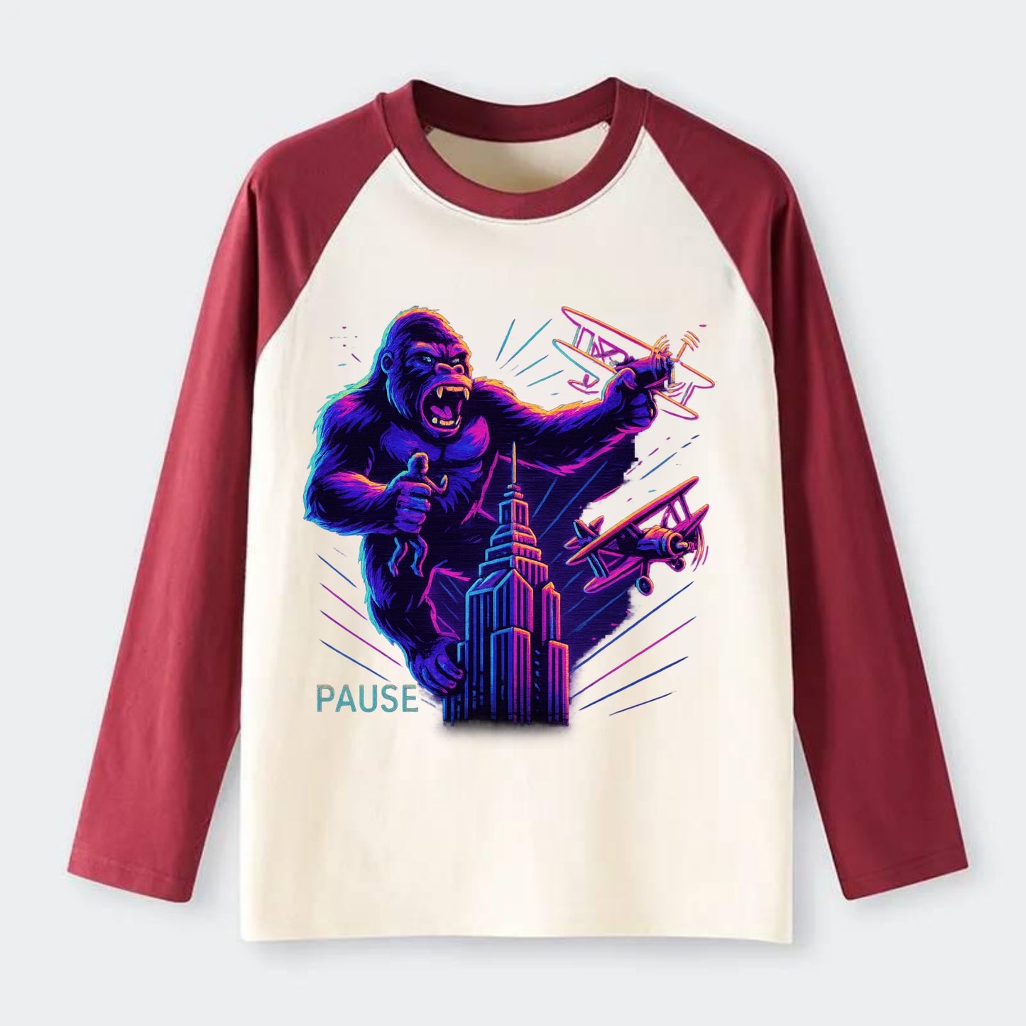 giant gorilla on top of skyscraper holding small figure, swatting - Raglan Long Sleeve T-Shirt - Red