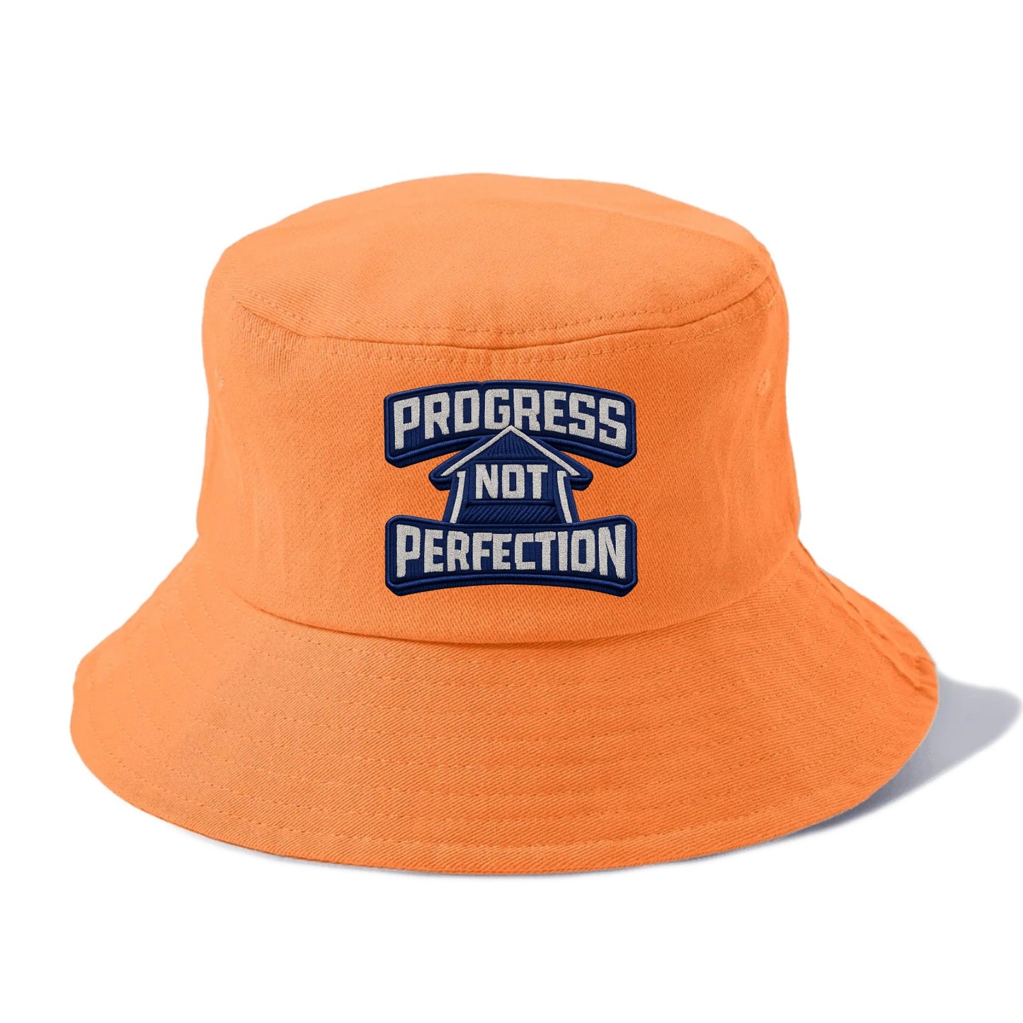 PROGRESS NOT PERFECTION - arrow with text in blue , growth mindset - Bucket Hat - Terracotta Clay(Orange)