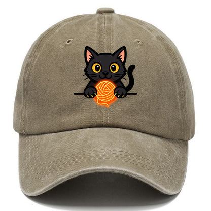 Midnight the black cat popping out of a gift box lid with ribbon trails. - Classic Cap - Warm Sand(Khaki)