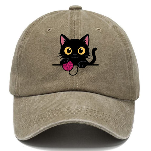 Midnight the black cat tapping the ledge rhythmically with one bright claw. - Classic Cap