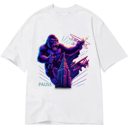 giant gorilla on top of skyscraper holding small figure, swatting planes - Classic T-shirt - White