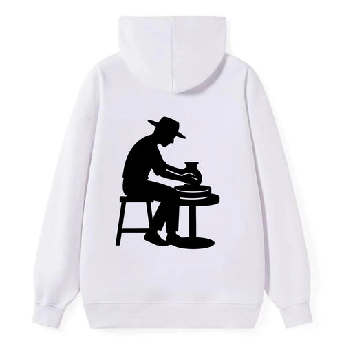 Potter shaping clay on wheel - Classic Pullover Hoodie