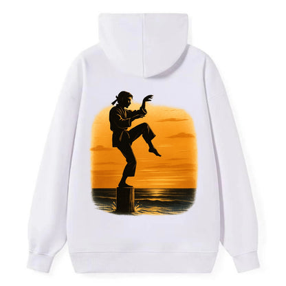 karate crane kick pose on wooden post at beach sunset - Classic Pullover Hoodie - White