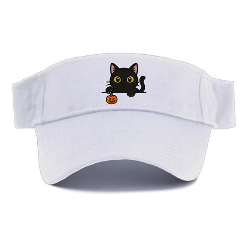 Midnight the black cat poking tongue out playfully while peeking. - Visor