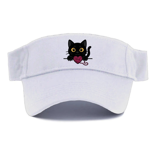Midnight the black cat stretching tall with claws gently hooked over the edge. - Visor - White