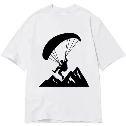 Paraglider soaring over mountain peaks - Classic T-shirt - White