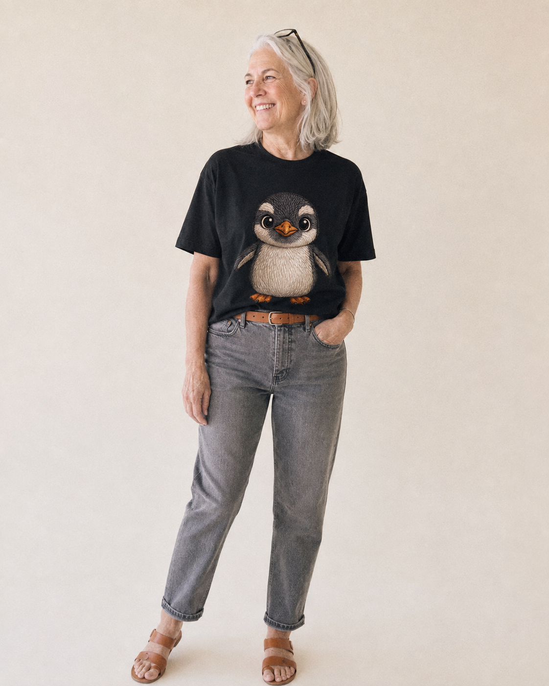 Baby Gentoo Penguin - orange beak, white cap, bright eyes, front-facing, energetic - Classic T-shirt – studio model photo