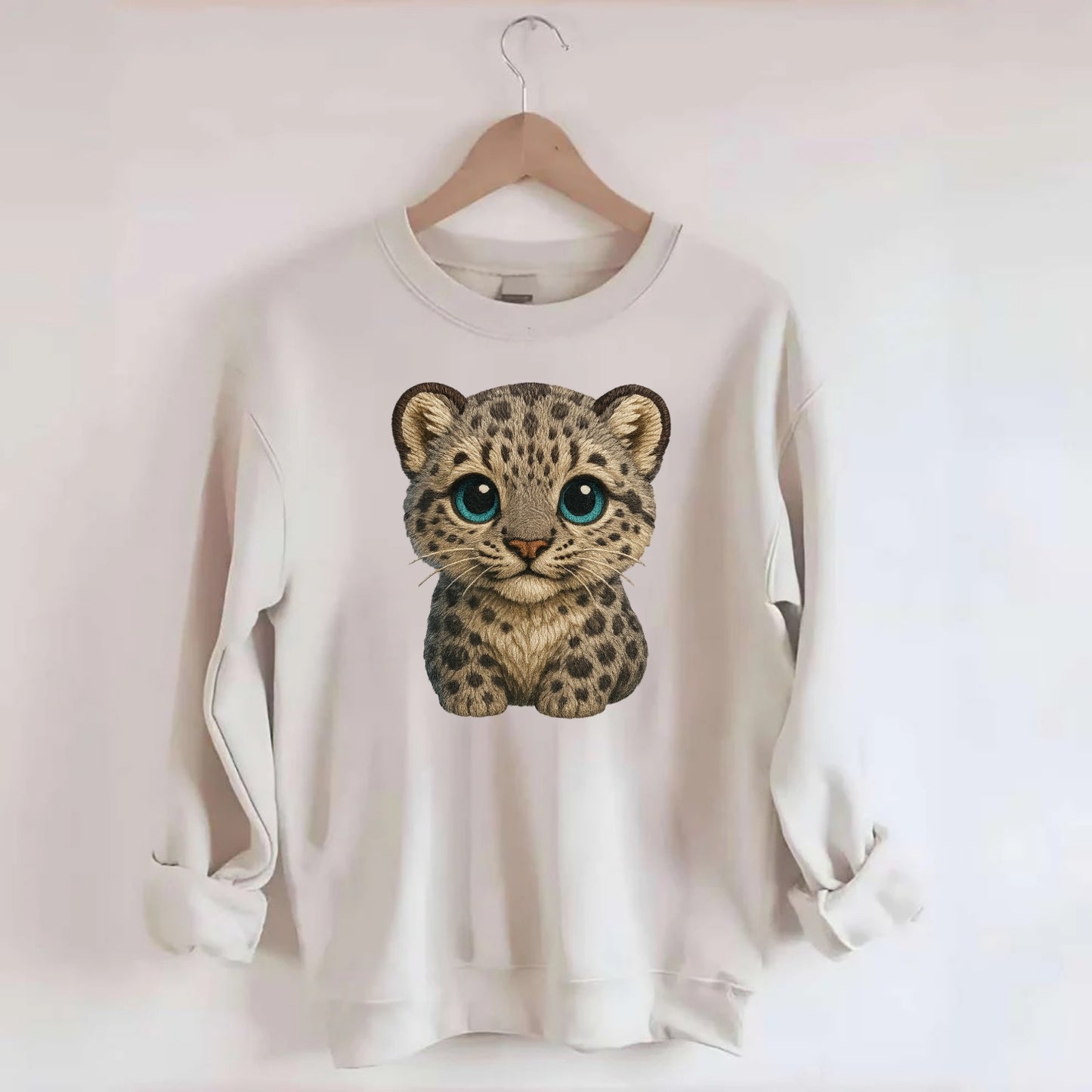 Baby Snow Leopard Cub - gray spotted, thick fur, blue-green eyes, - Crewneck Sweatshirt - biege