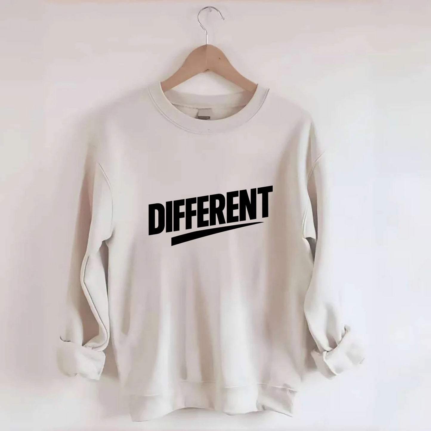 Bold typography design - "DIFFERENT" - standing out, not following crowd - Crewneck Sweatshirt - biege