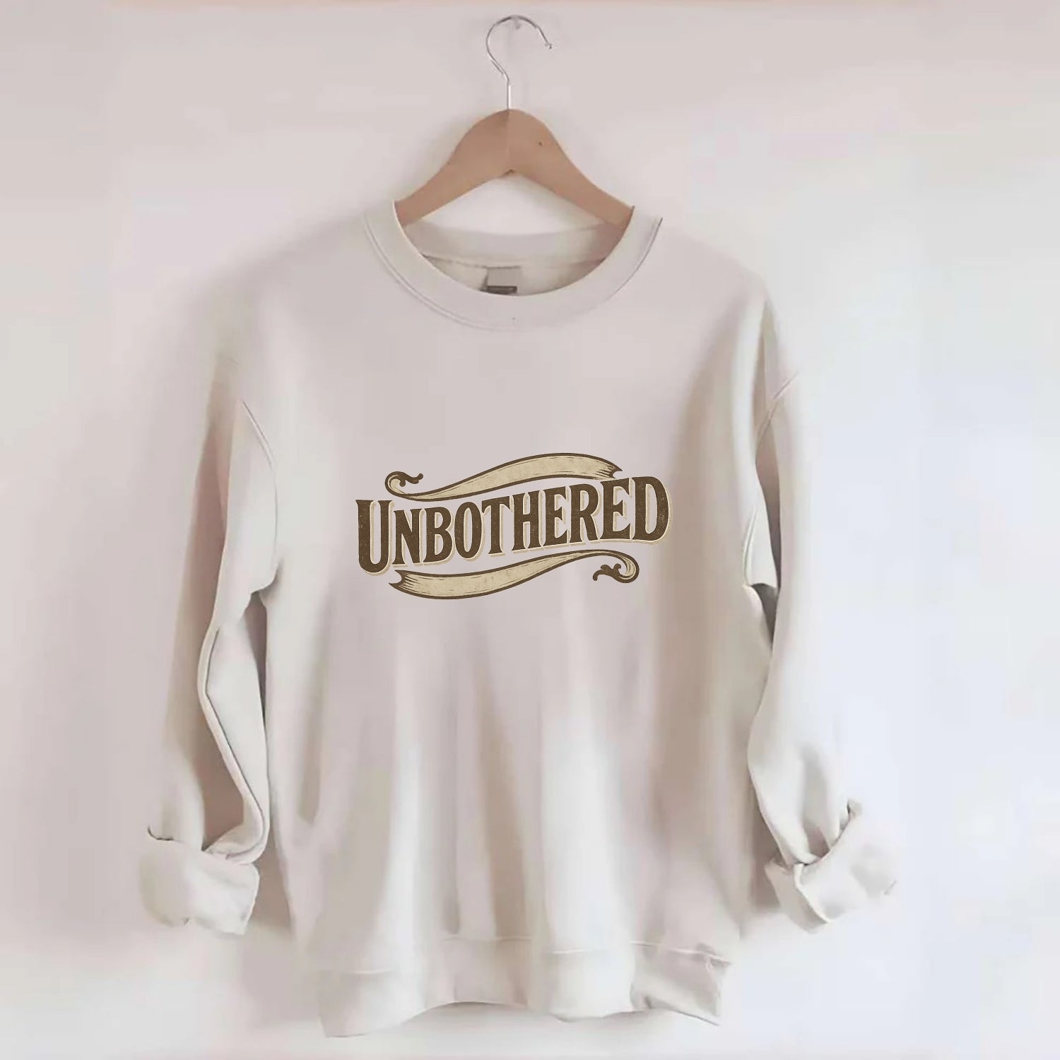 Bold typography design - "UNBOTHERED" - not affected, staying calm - Crewneck Sweatshirt - biege