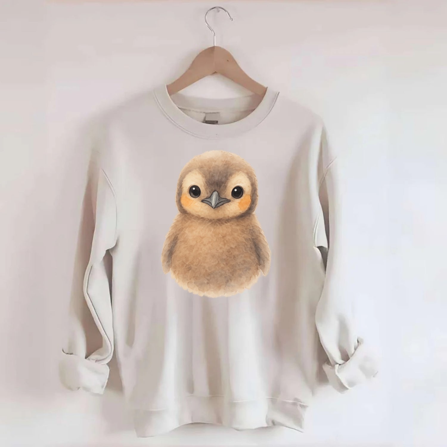 Baby King Penguin - orange cheek patches, fluffy brown, large eyes, - Crewneck Sweatshirt - biege