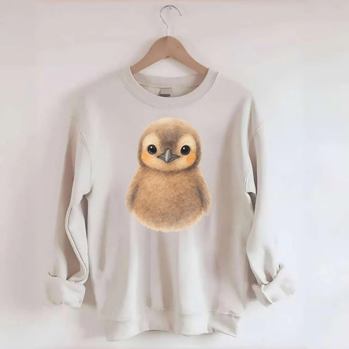 Baby King Penguin - orange cheek patches, fluffy brown, large eyes, - Crewneck Sweatshirt
