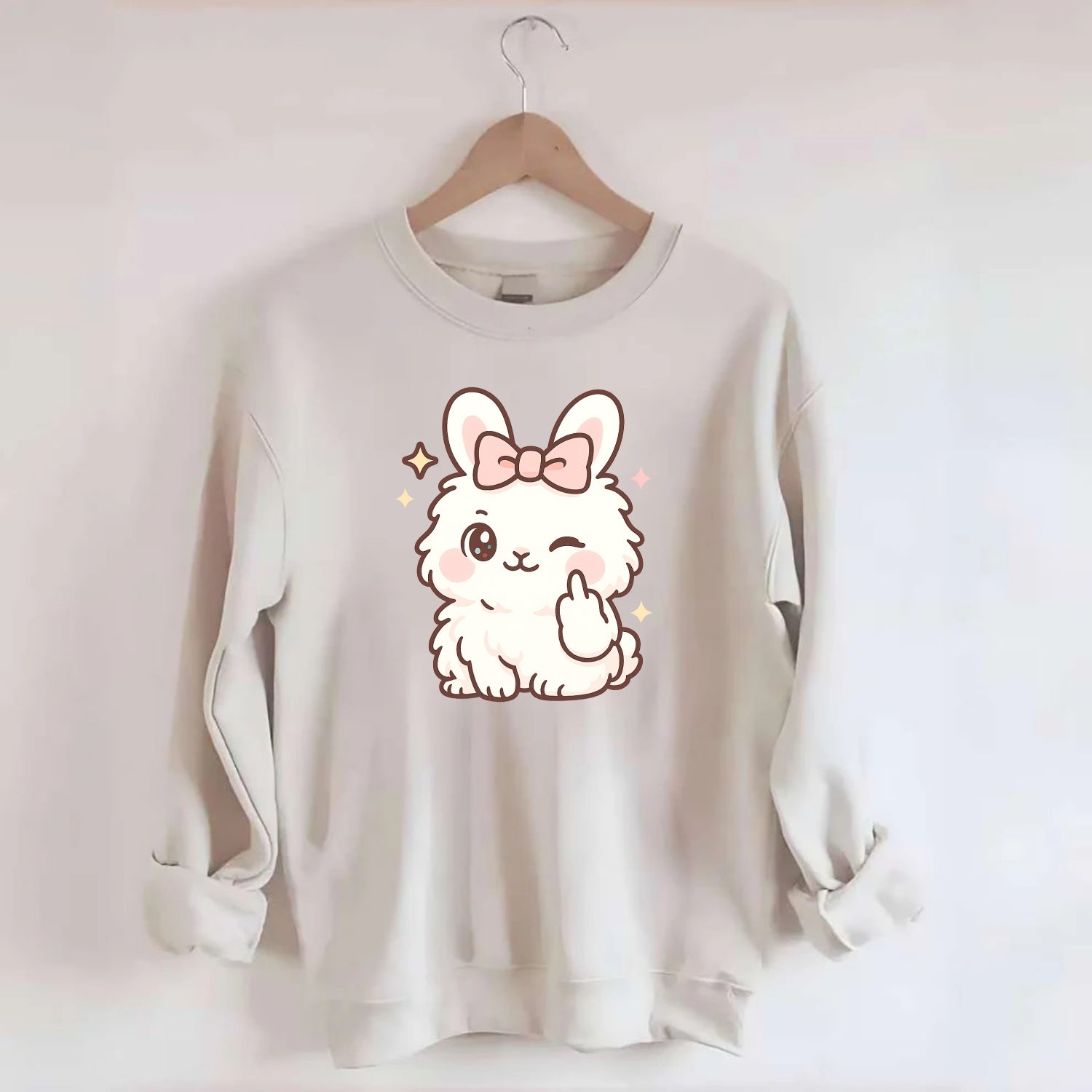 fluffy white angora rabbit with pink bow, one paw delicately flipping off - Crewneck Sweatshirt - biege