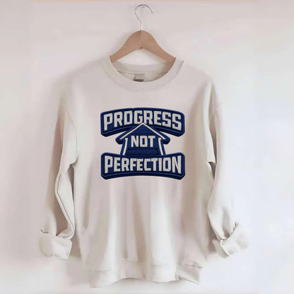 PROGRESS NOT PERFECTION - arrow with text in blue , growth mindset - Crewneck Sweatshirt - biege