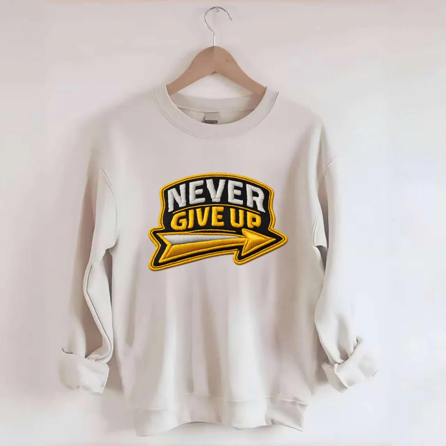 NEVER GIVE UP - bold text with arrow in gold , determination - Crewneck Sweatshirt - biege