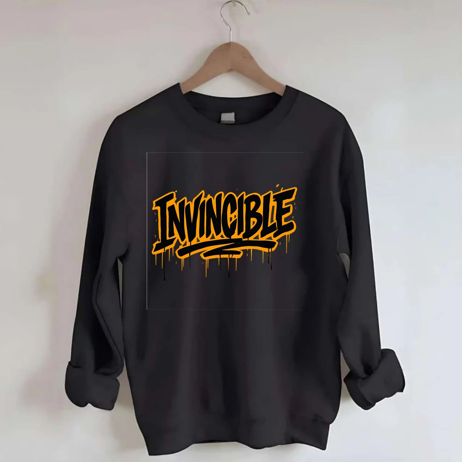 Bold typography design - "INVINCIBLE" - cannot be defeated, unconquerable - Crewneck Sweatshirt - black