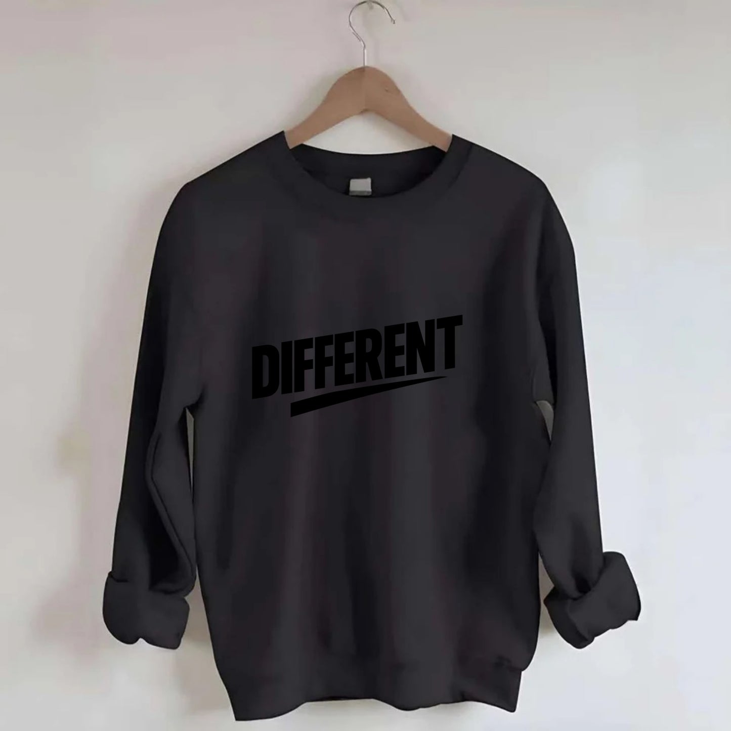 Bold typography design - "DIFFERENT" - standing out, not following crowd - Crewneck Sweatshirt - black