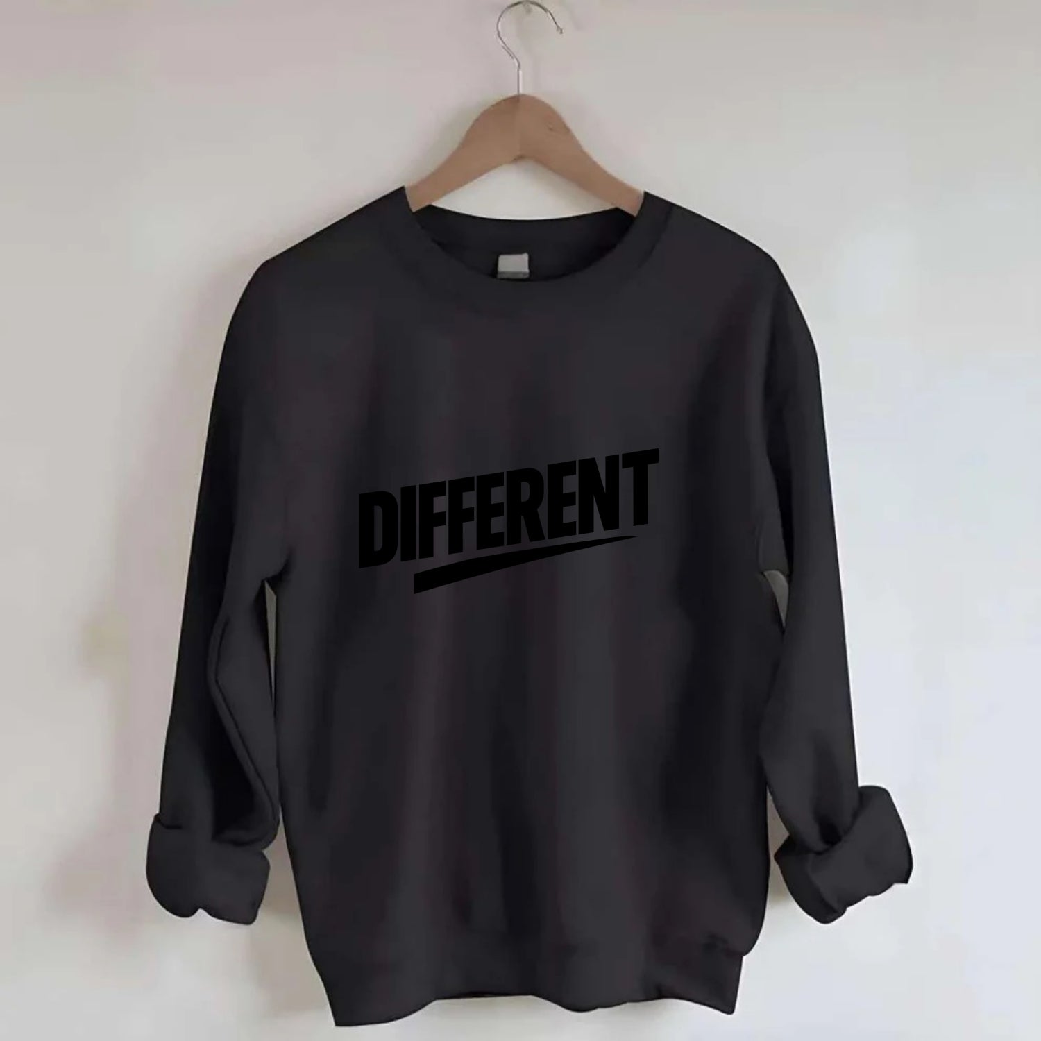 Bold typography design - "DIFFERENT" - standing out, not following crowd - Crewneck Sweatshirt - black
