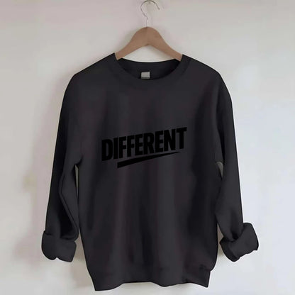 Bold typography design - "DIFFERENT" - standing out, not following crowd - Crewneck Sweatshirt - black