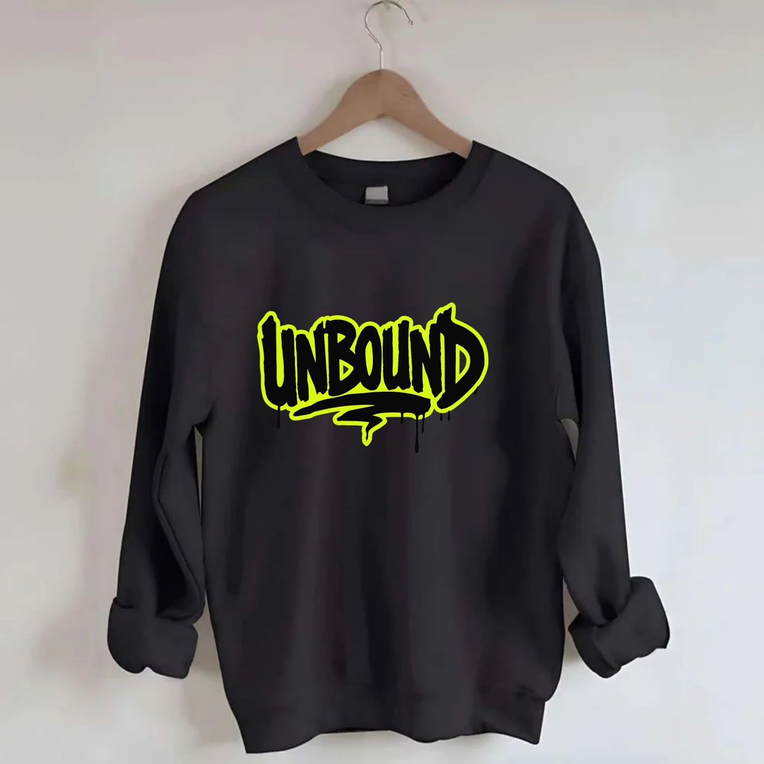 Bold typography design - "UNBOUND" - without limits, free from constraints - Crewneck Sweatshirt - black