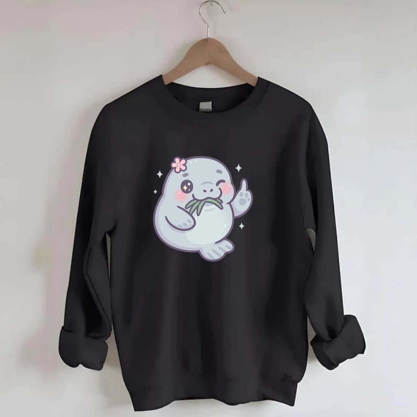chubby manatee munching on seagrass, one flipper raised with sass - Crewneck Sweatshirt - black