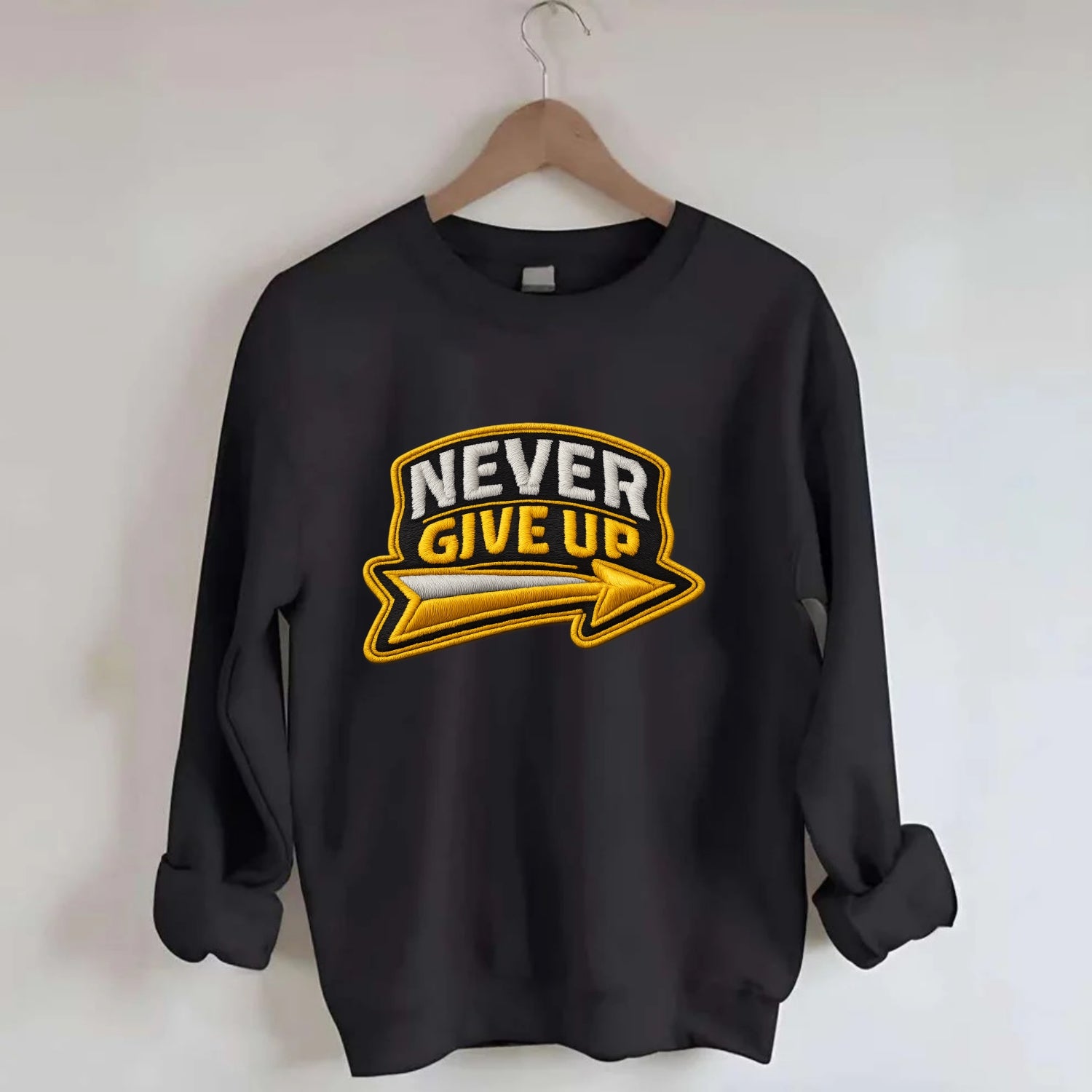 NEVER GIVE UP - bold text with arrow in gold , determination - Crewneck Sweatshirt - black