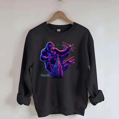 giant gorilla on top of skyscraper holding small figure, swatting planes - Crewneck Sweatshirt - black