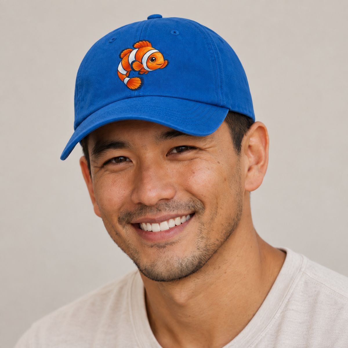 Clownfish Crescent Swim Sea Sprite Baseball Cap — studio model wearing the hat