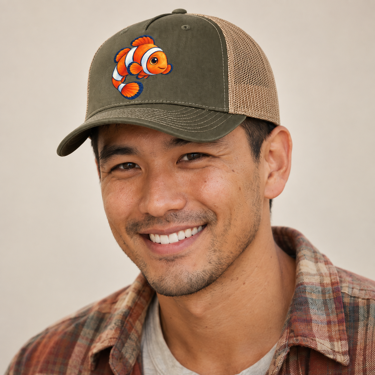 Clownfish Crescent Swim Sea Sprite Trucker Hat — studio model wearing the hat