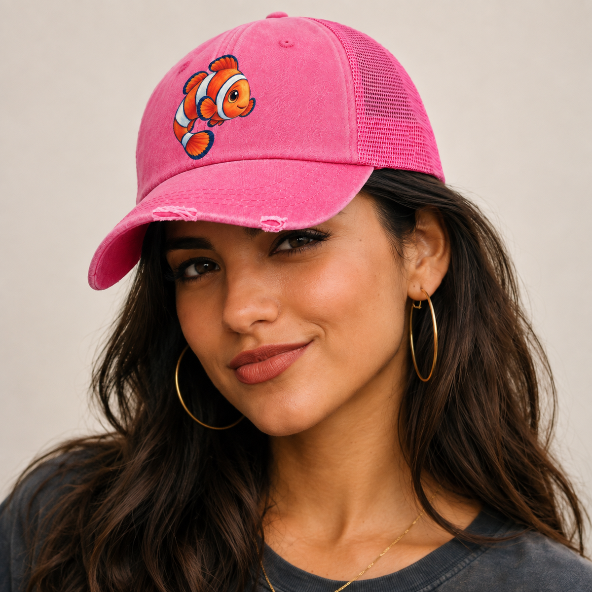 Clownfish Crescent Swim Sea Sprite Washed Trucker Hat — studio model wearing the hat