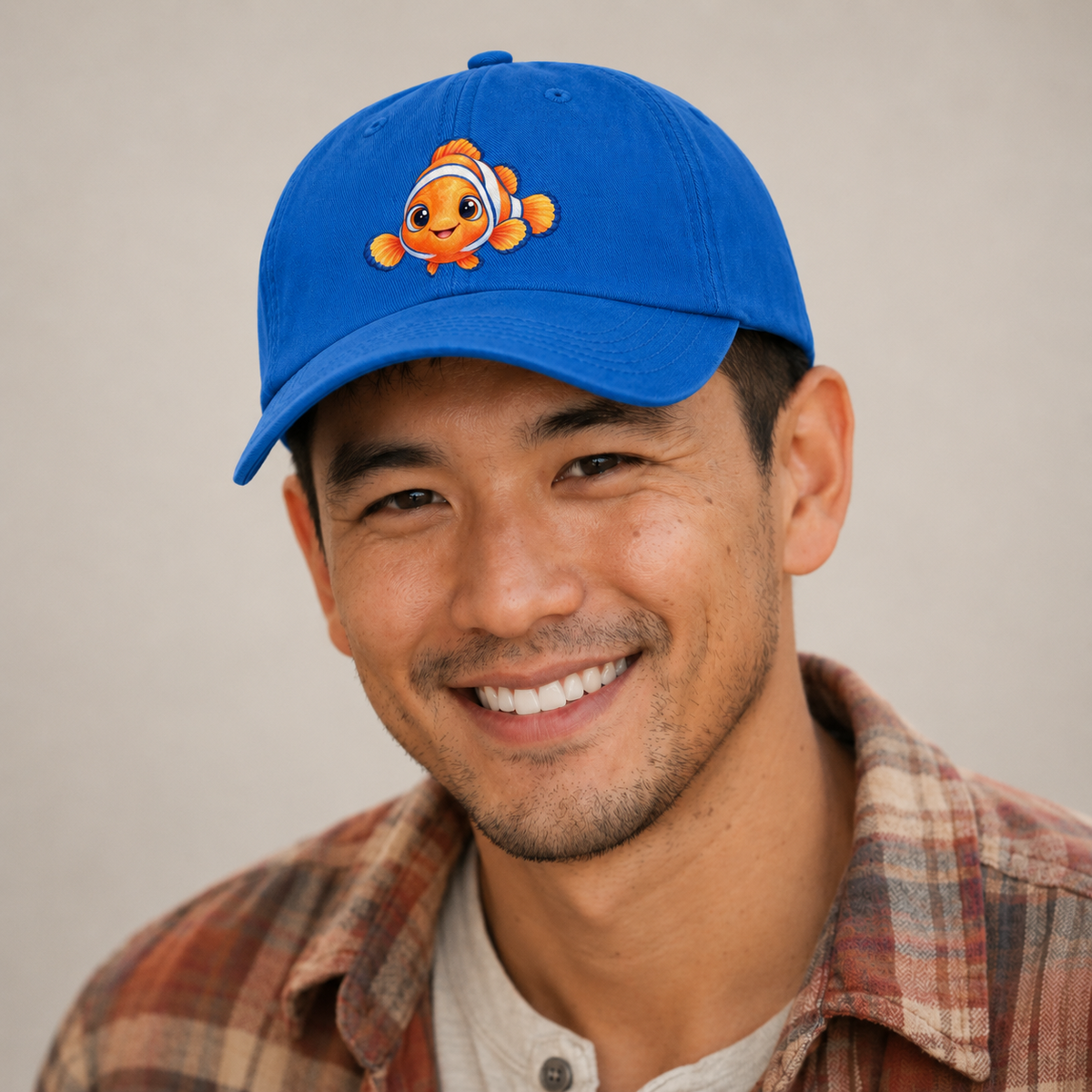 Clownfish Symmetric Hello Sea Sprite Baseball Cap — studio model wearing the hat