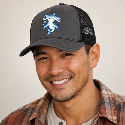 Hammerhead Shark Curious Tilt Sea Sprite Trucker Hat — studio model wearing the hat