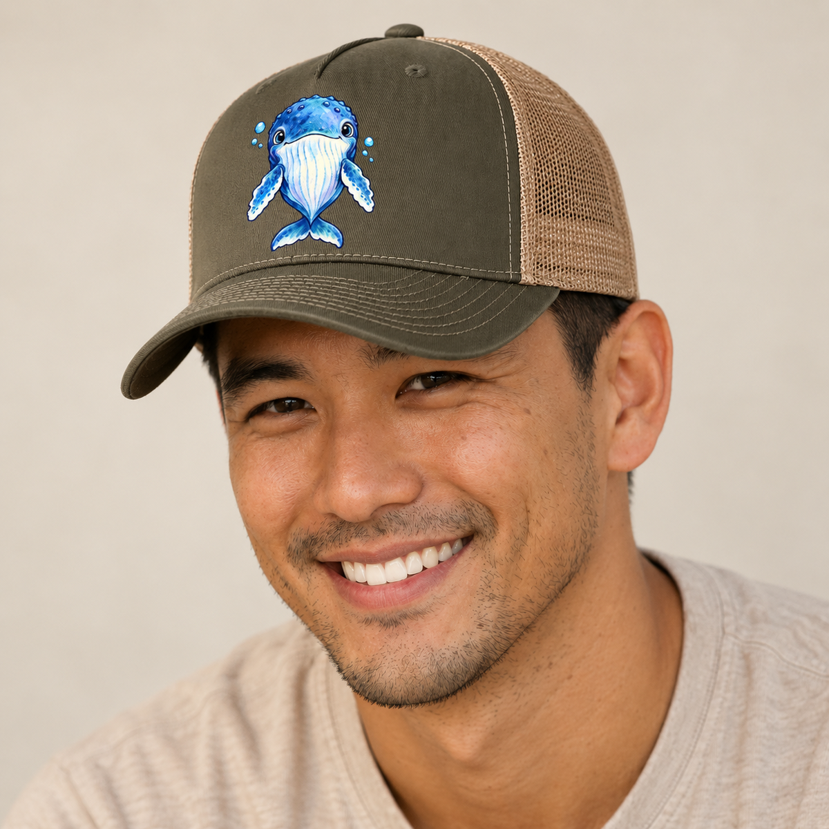 Humpback Whale Front Float Sea Sprite Trucker Hat — studio model wearing the hat