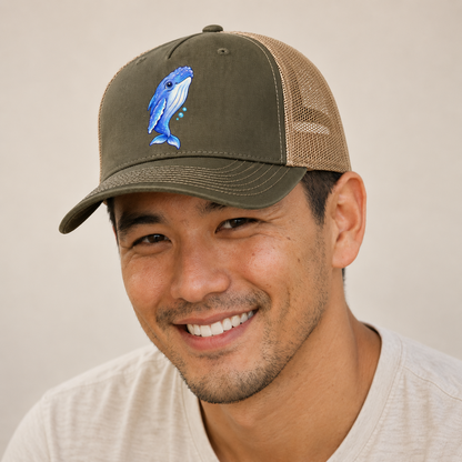 Humpback Whale Gentle Rise Sea Sprite Trucker Hat — studio model wearing the hat