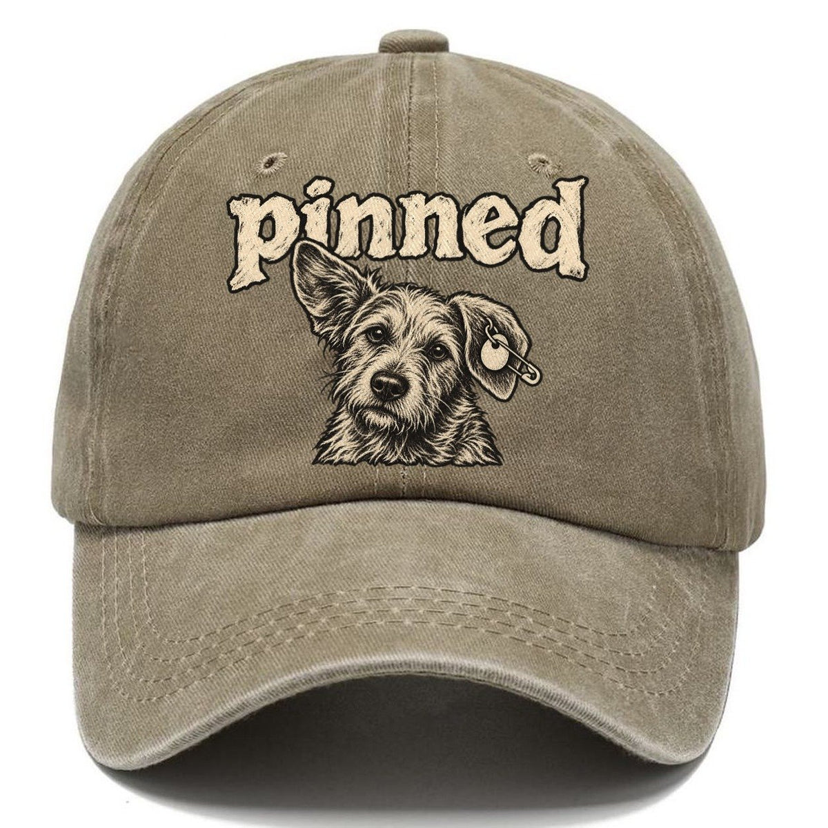 A Scruffy Dog Head With A Safety Pin Through The Ear Tag Bark For Me Classic Cap – Warm Sand