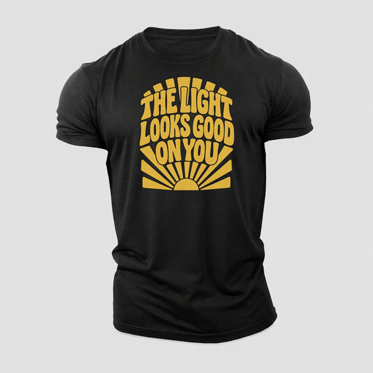 The Light Looks Good On You Sunburst Sayings Cotton T-Shirt – Black