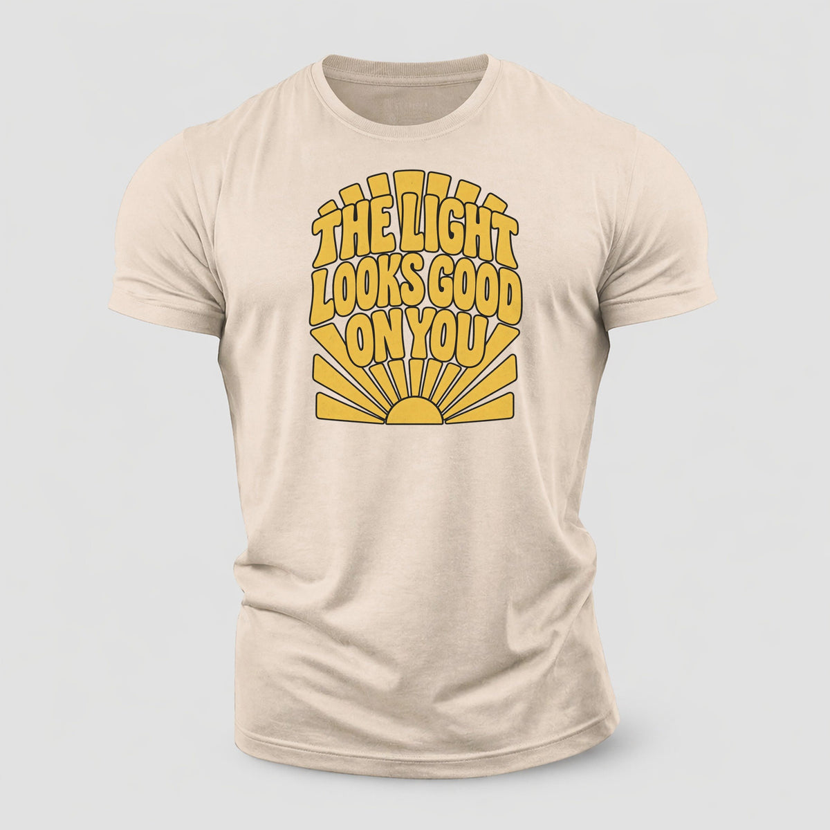 The Light Looks Good On You Sunburst Sayings Cotton T-Shirt – Sand