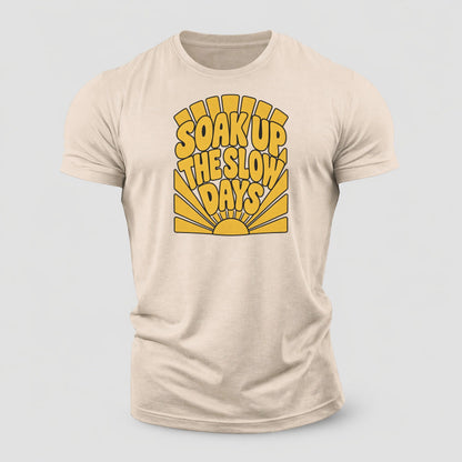 Soak Up The Slow Days Sunburst Sayings Cotton T-Shirt – Sand