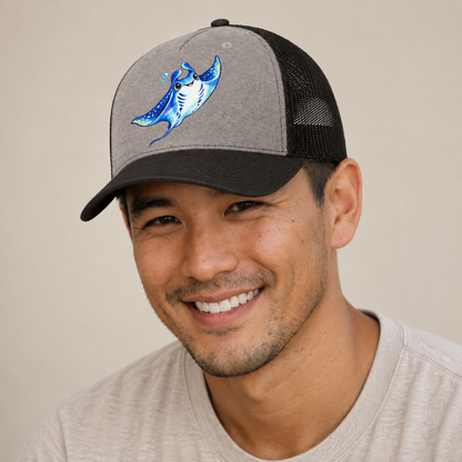 Manta Ray Upward Glide Sea Sprite Trucker Hat — studio model wearing the hat