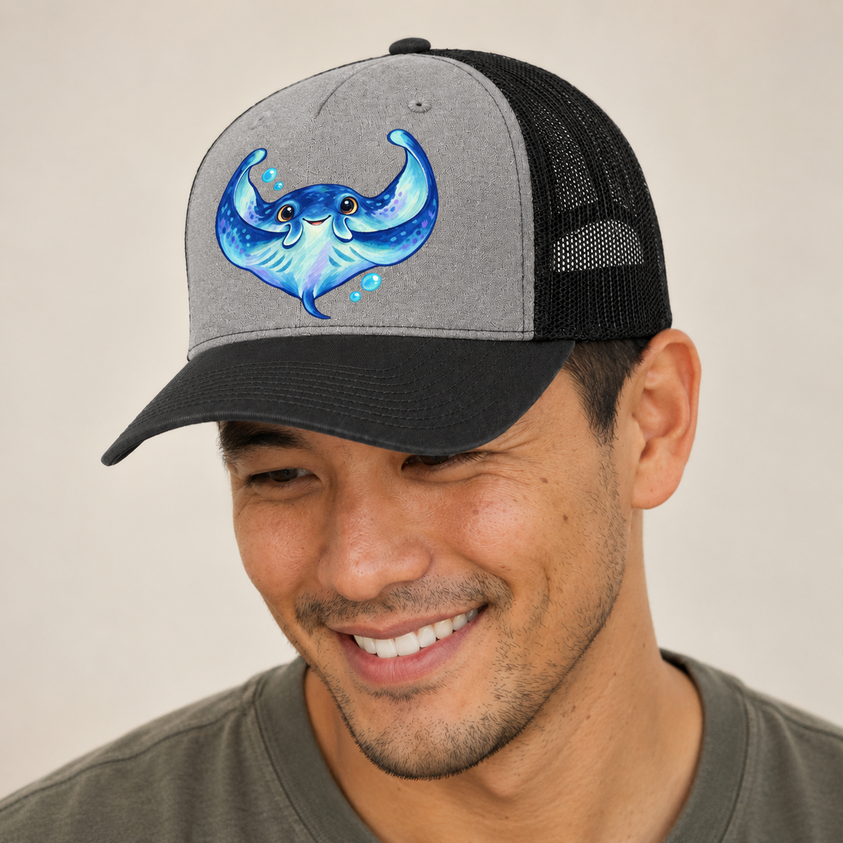 Manta Ray Wing Hug Sea Sprite Trucker Hat — studio model wearing the hat